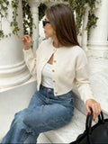 Cardigan color crema