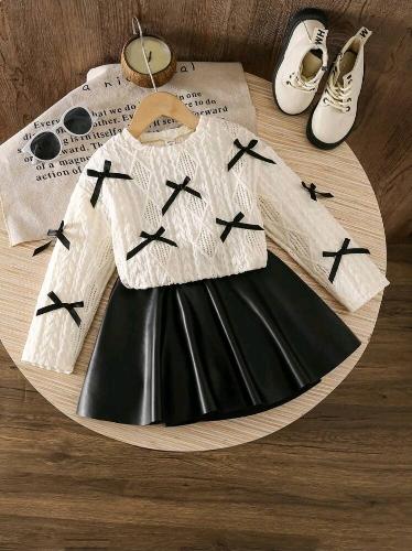 Conjunto sueter tejido y falda cuerina