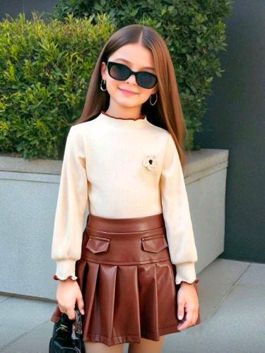 Conjunto de sueter y falda de cuerina