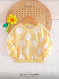 Sueter amarillo de flores blancas
