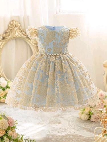 Vestido celeste con detalles dorados
