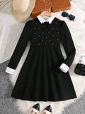 Vestido negro con pepas blancas